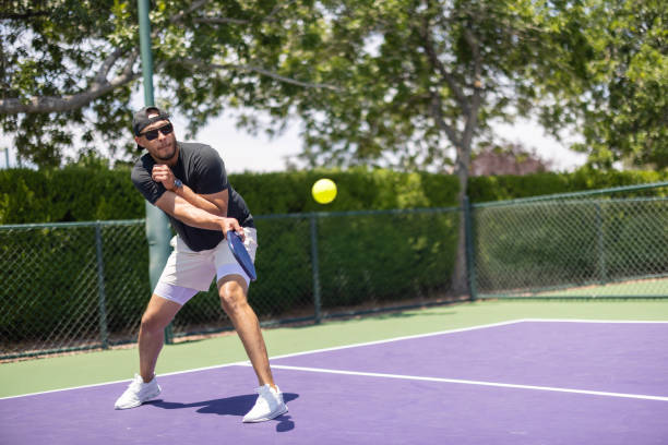 A man playing pickleball
