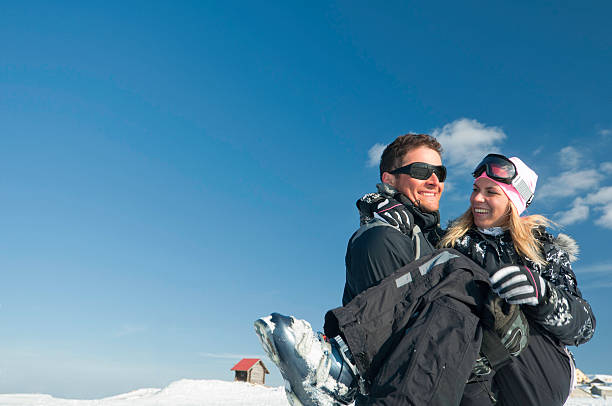 "Young couple on a ski vacation. Polarizing filter, convenient copy space"