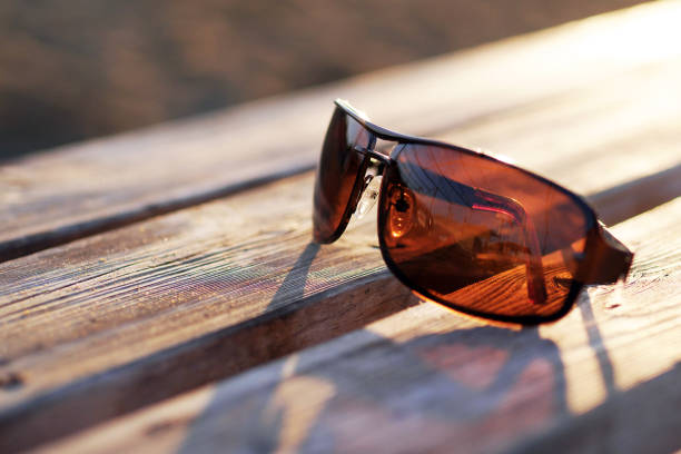 brown sunglasses on a wooden table